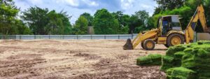 large yard with land grading equipment