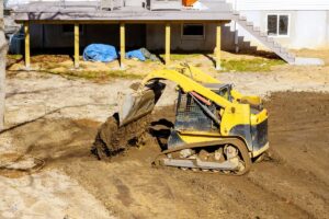 small tractor digging land working with lang